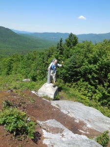 Cecilia at the completion of the Long Trail on the Canada border