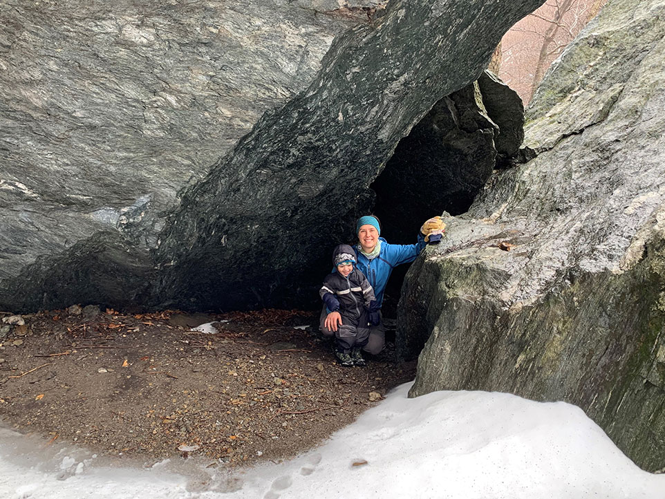 Amy and Quinn between rocks on Smugglers Notch