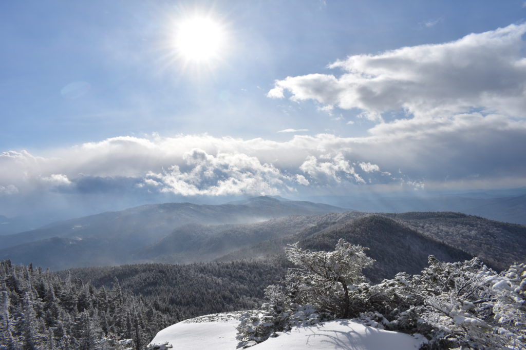 sun shines on mountain ridgeline