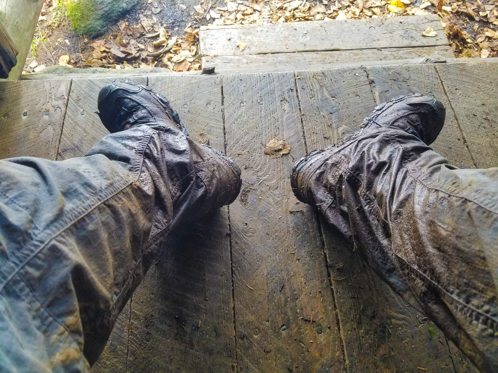 Mud-covered boots and pants.
