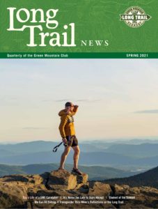 cover of spring Long Trail News hiker on summit gazing into distance