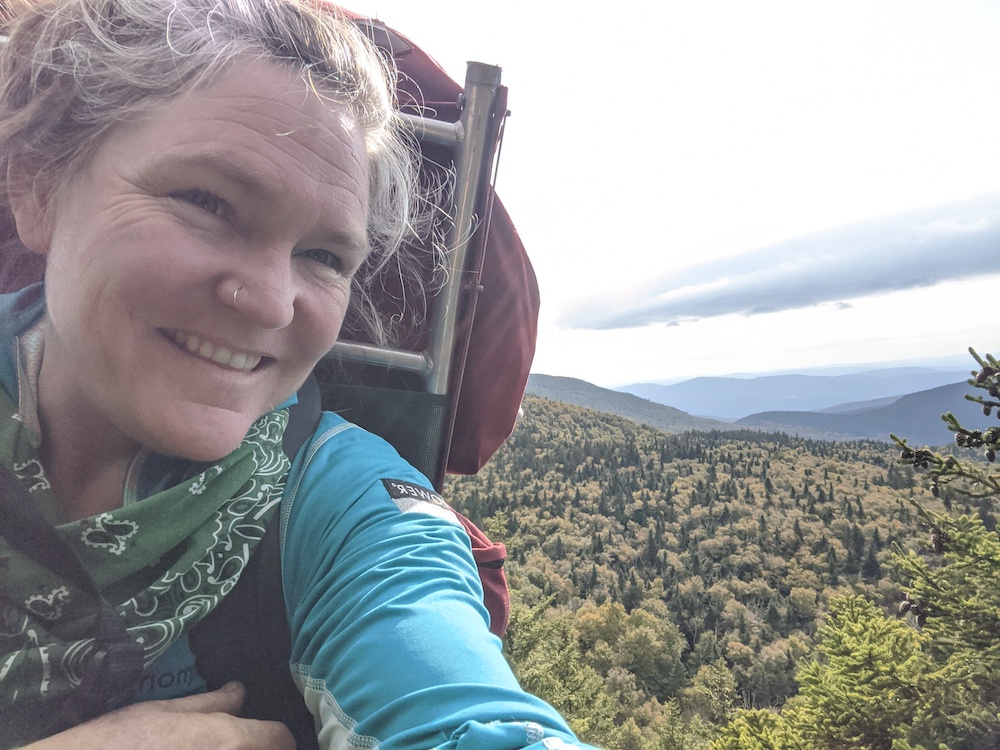 Selfie of female hiker with pack