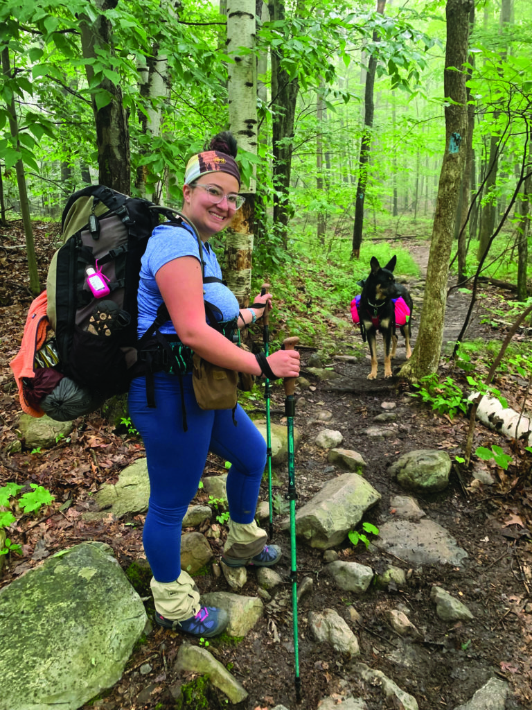 hiker with pack and dog on the long trail 