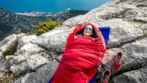 hiker insleeping bag on rock