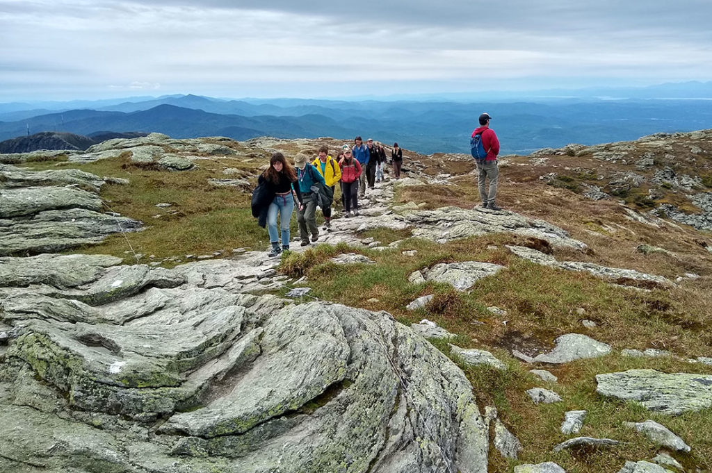 Caretakers are sure to walk along rocks to protect alpine flora on Mt. Mansfield.