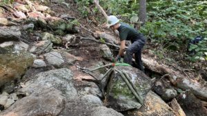 long trail patrol moves a rock with a griphoist