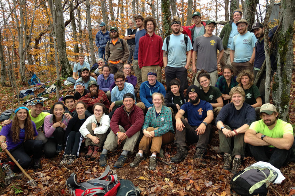 VHCB AmeriCorps Caitlin Miller leads college students in a volunteer project on Stimson Mountain in Bolton.