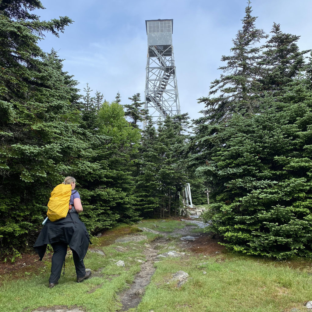 Kara Richardson Whitely approaches fire tower during 100 miles of LT hike.