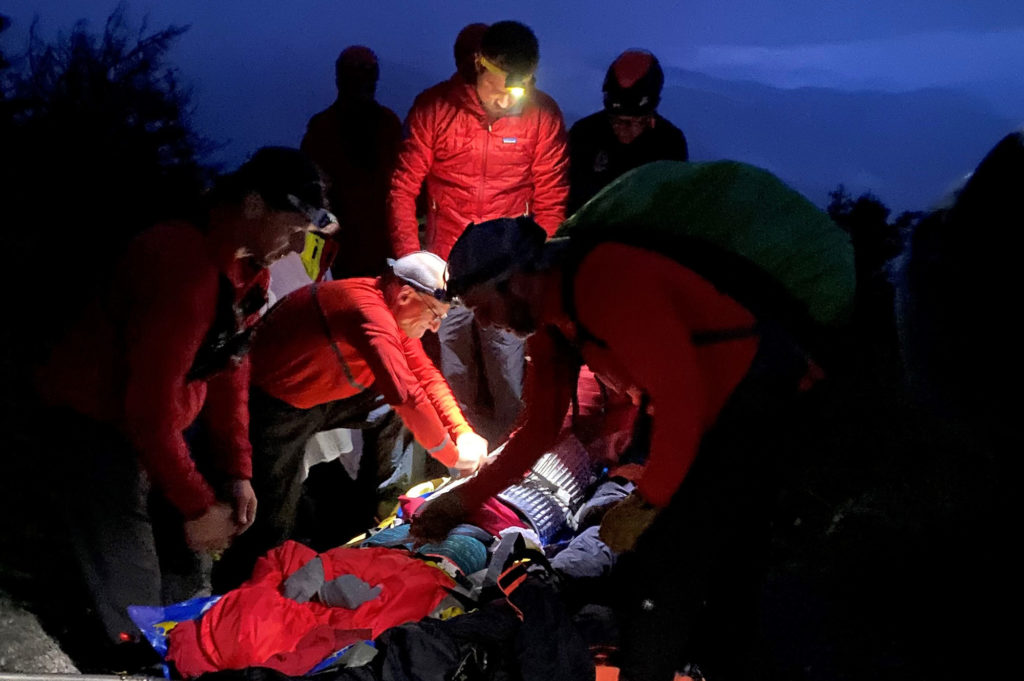 Stowe Mountain Rescue members package the patient on Sunset Ridge in preparation for evacuation.