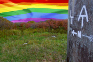 Bromley Summit with LGBTQ+ Pride flag backdrop