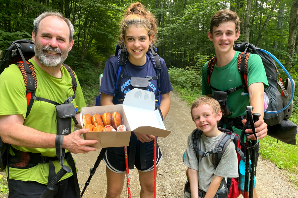 Matt Krebs and his kids — Ruth, Joe, and Charlie — pose with donuts on Long Trail.