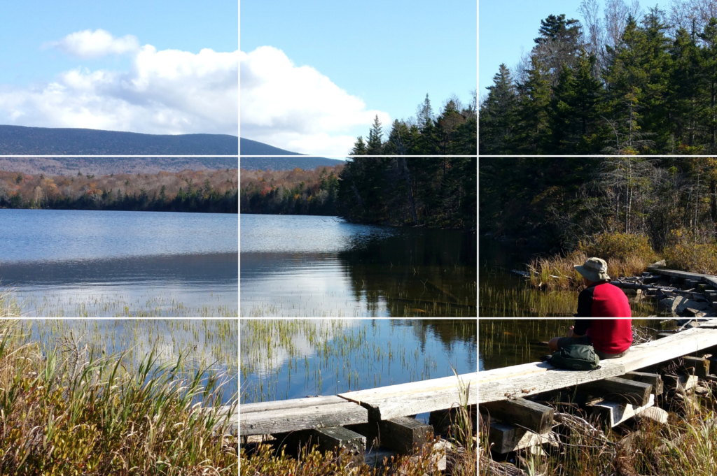 Subject sits on Lye Brook Trail looking out at Stratton Pond; demonstrates rule of thirds concept.