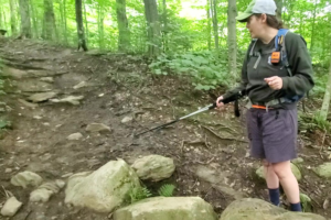 Kathryn Wrigley studies Burrows Trail for its planned rehabilitation.