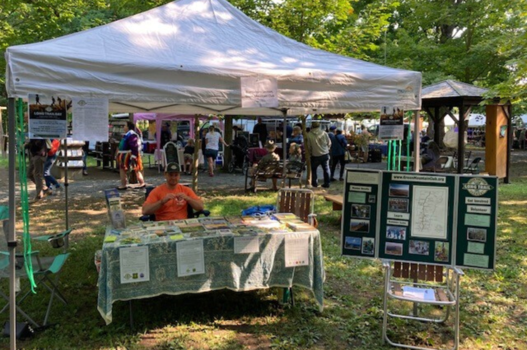 Brattleboro Section's Collier Shutter tables at the local farmer's market for Long Trail Day 2022.