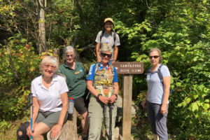 members enjoy a group hike