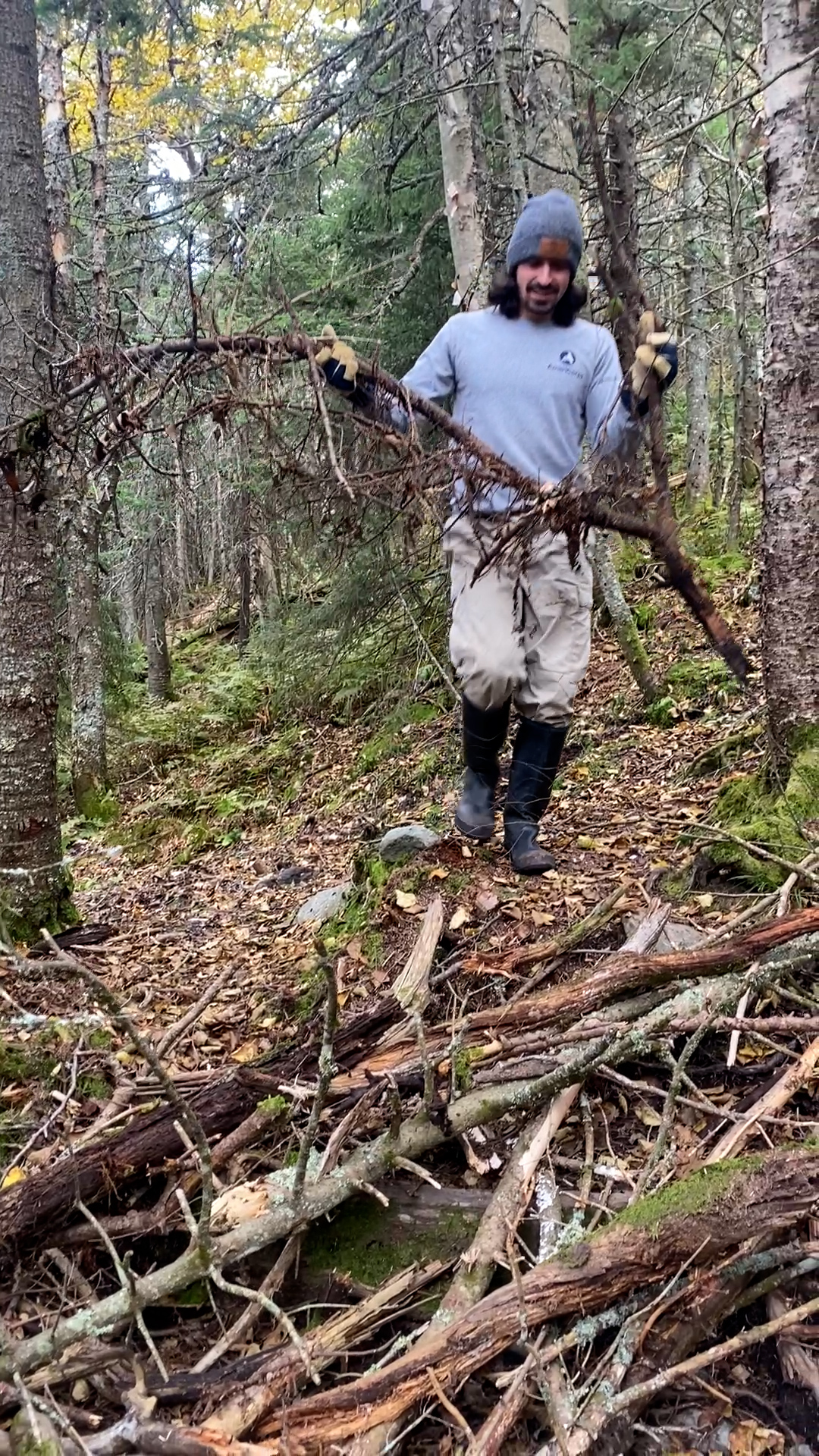 Crew member builds a brush in