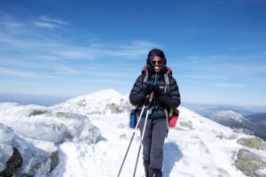 Mardi Fuller in winter at the summit of one of the NH48.