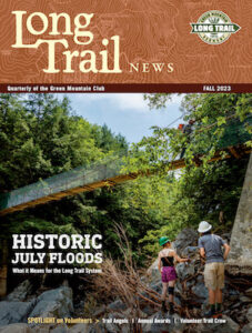 Cover of the Long Trail News - two field staff members inspect the Clarendon Gorge Bridge. Cover reads "Historic July Floods"